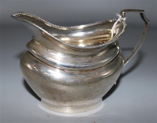 A George V silver oval cream jug, 5.5 oz.
